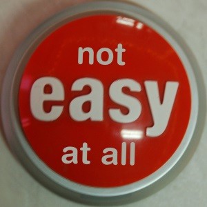 an easy button that reads "not easy at all"