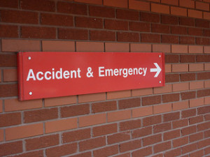 Accident & Emergency - Hospital sign indicating healthcare industry under siege